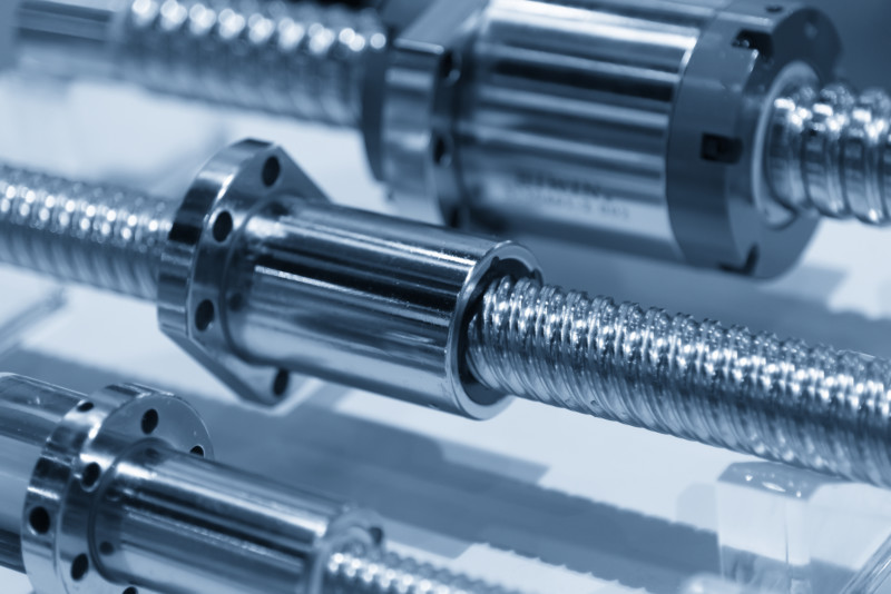 The lead screw shaft spare part of CNC machine in the light blue scene.The hi-precision CNC spare part